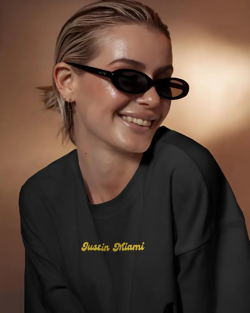 Justin Miami Glamourous Oversized T-Front fashion forward long sleeve tshirt mockup smiling model in sunglasses warm golden light (1).webp